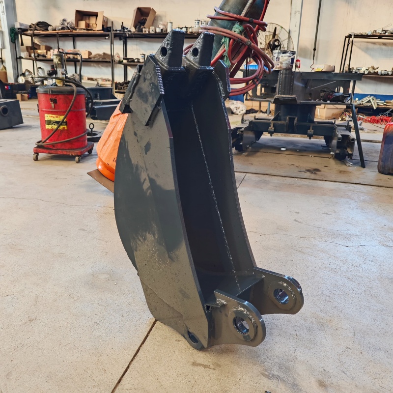 Small excavator equipped with loading attachments - small bucket/narrow bucket