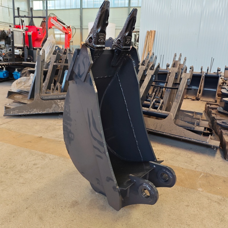 Small excavator equipped with loading attachments - small bucket/narrow bucket