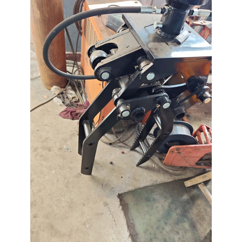 Mini excavator attachment-rotating grass and tree grabber