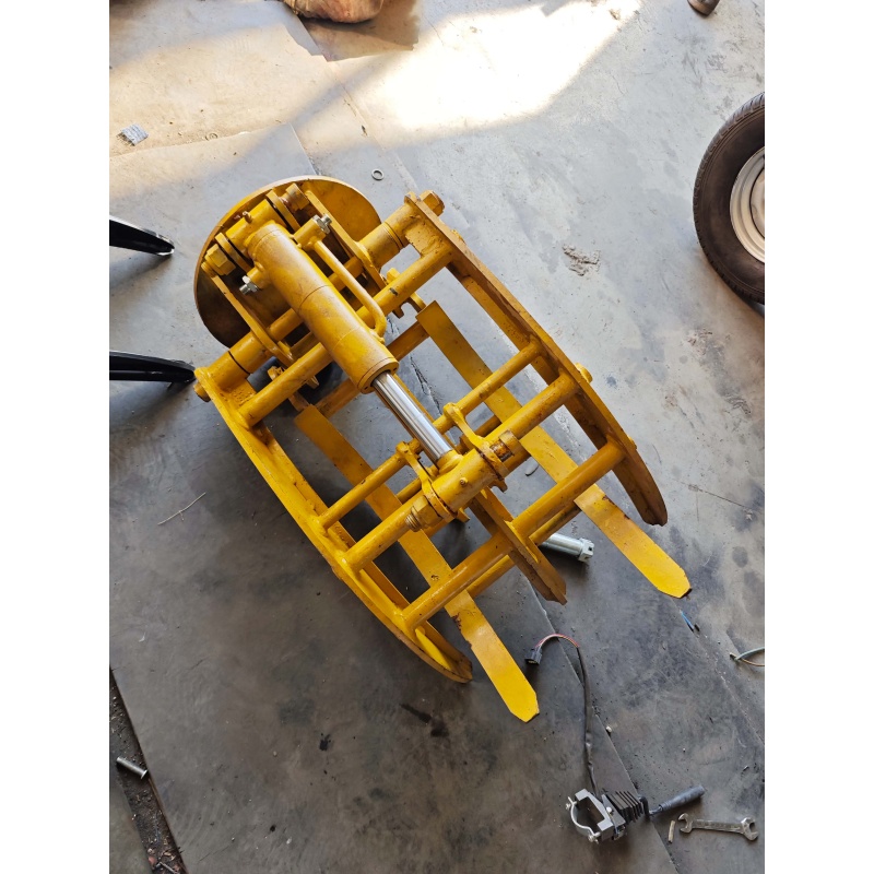 Mini excavator attachment-rotating grass and tree grabber