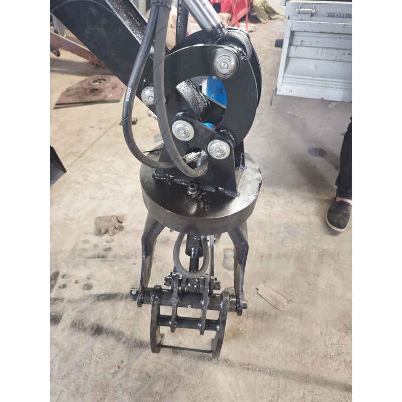 Small Excavator Attachment-Rotating Grass and Tree Catcher