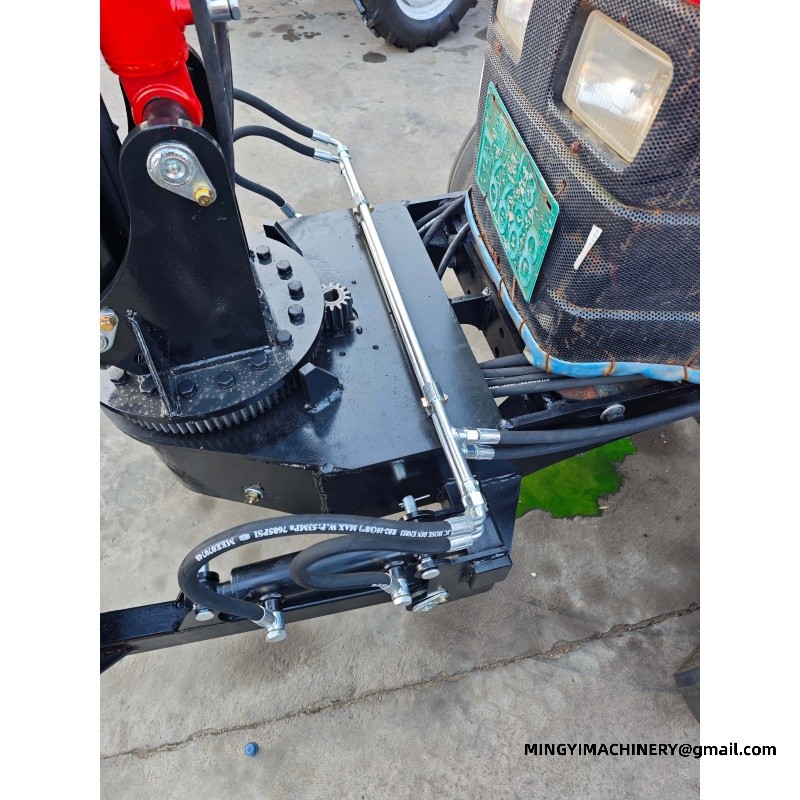 small farm tractor with backhoe attachment