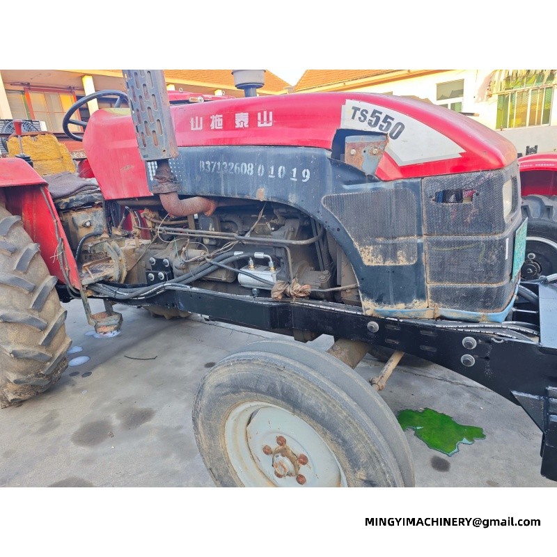 small farm tractor with backhoe attachment